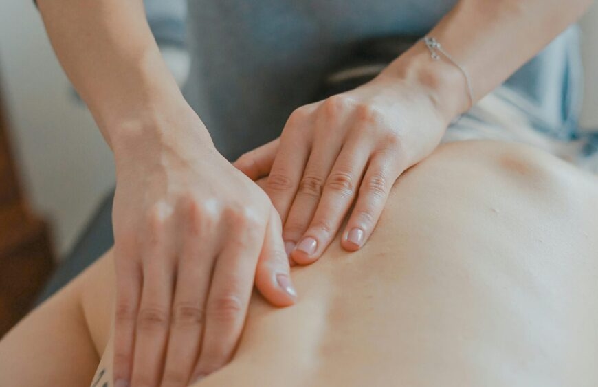 man massaging woman's body